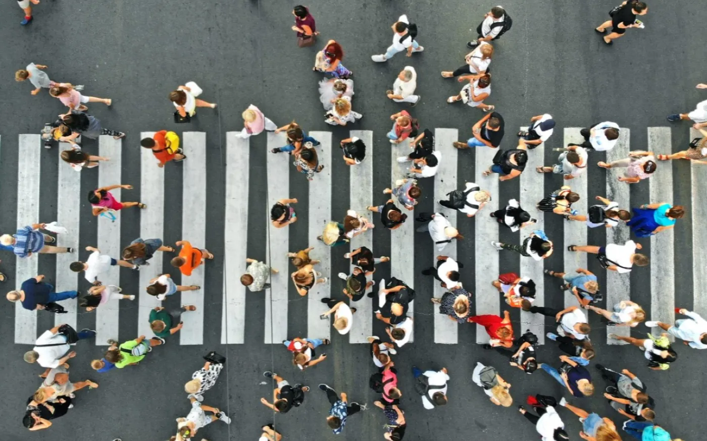 People crowd on pedestrian crosswalk